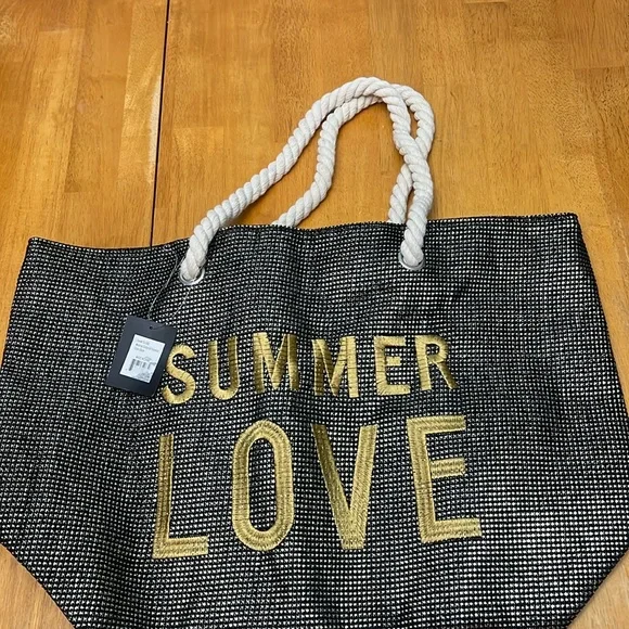 Unused Yumi beach bag w zipper, rope handles. Black metallic w gold lettering. - Picture 1 of 3